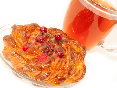 Delicious freshly baked pastry  with cranberries and cup of teaの写真素材
