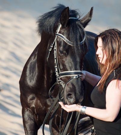 women with black horse.の写真素材