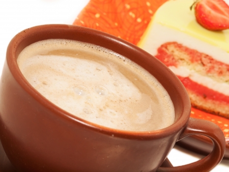 Cup of cappuccino coffee with cakeの写真素材