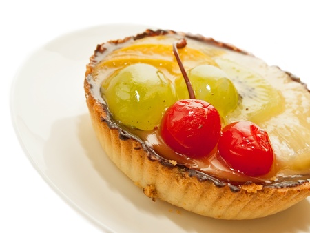Cake with Cherry and fruits over whiteの写真素材