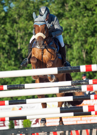 SAINT PETERSBURG-JULY 05: Rider Maxim Kryna on Klooney 26 in CSI3*-W/CSIYH1* International Jumping Grand Prix FEI World Cup Competition 150cm on July 05, 2014  in Saint Petersburg, Russia.のeditorial素材