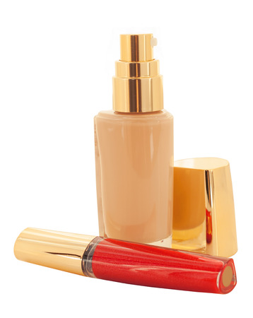 luxury foundation and lip gloss isolated on whiteの写真素材