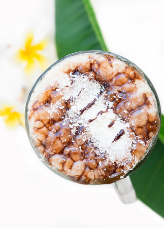 Frappe Iced Coffee Drink with plumeriaの写真素材