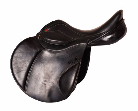 Black leather professional jumping saddle without stirrup. isolatedの写真素材