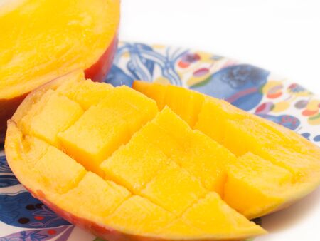Ripe Mango with slices on plate. close upの写真素材