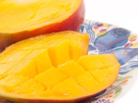Ripe Mango with slices on plate. close upの写真素材