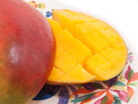 Ripe Mango with slices on plate. close upの写真素材