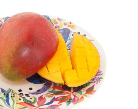 Ripe Mango with slices on plate. close upの写真素材