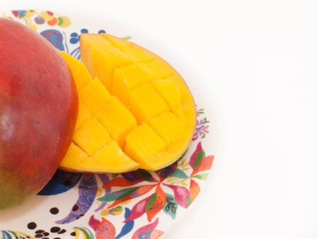 Ripe Mango with slices on plate. close upの写真素材