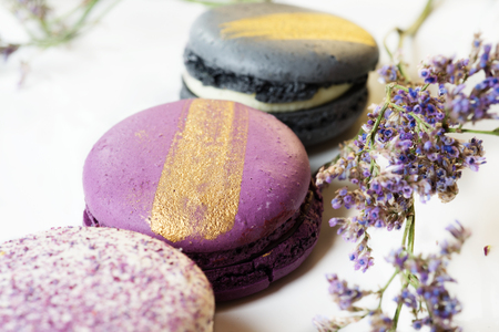 colorful macaroon cakes  against white backgroundの写真素材
