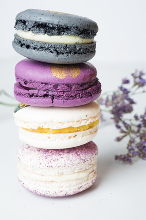 colorful macaroon cakes  against white backgroundの写真素材