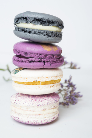 colorful macaroon cakes  against white backgroundの写真素材