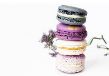 colorful macaroon cakes  against white backgroundの写真素材