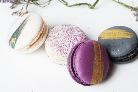 colorful macaroon cakes  against white backgroundの写真素材