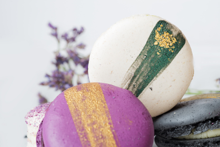 colorful macaroon cakes  against white backgroundの写真素材