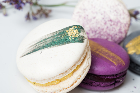 colorful macaroon cakes  against white backgroundの写真素材