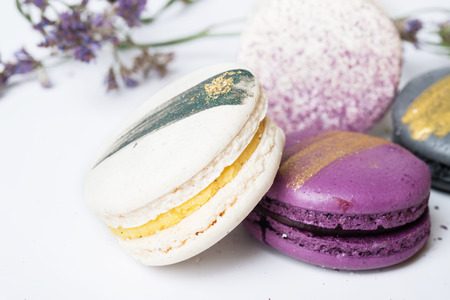 colorful macaroon cakes  against white backgroundの写真素材