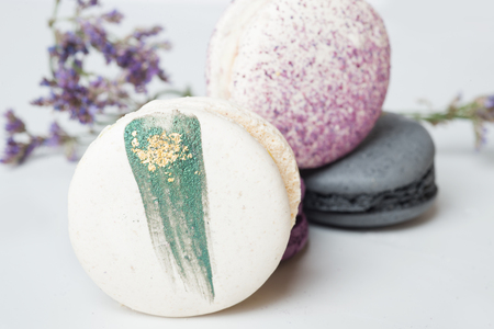 colorful macaroon cakes  against white backgroundの写真素材