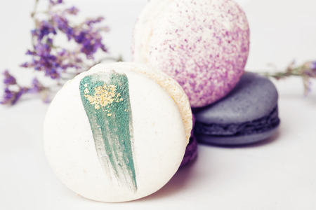 colorful macaroon cakes  against white backgroundの写真素材