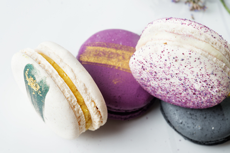colorful macaroon cakes  against white backgroundの写真素材