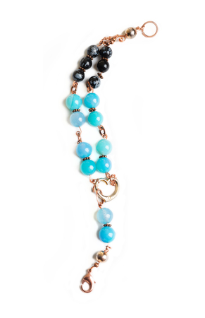 jewerly bracelet  with chalcedony and obsidian around white backgroundの写真素材