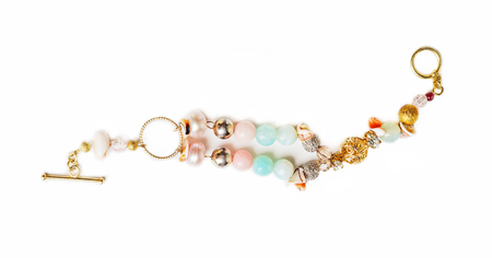 Gold jewelry bracelet with semiprecious at white backgroundの写真素材