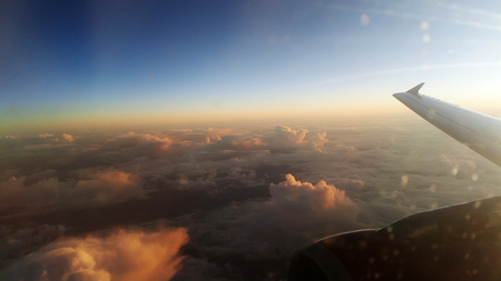  cloudscape background from airplane . sunsetの写真素材