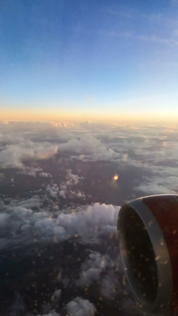  cloudscape background from airplane . sunsetの写真素材