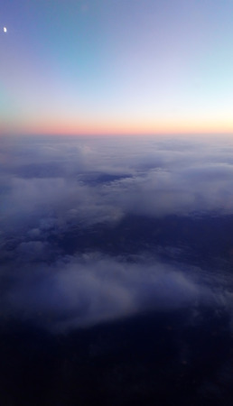  cloudscape background from airplane . sunsetの写真素材