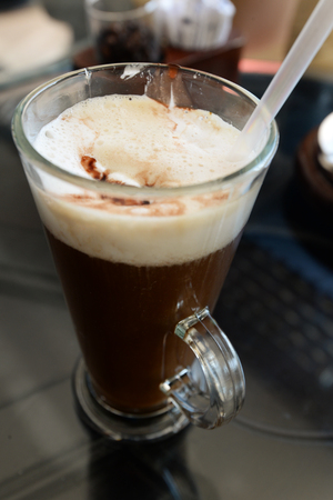 cappuccino in glass in cafeの写真素材