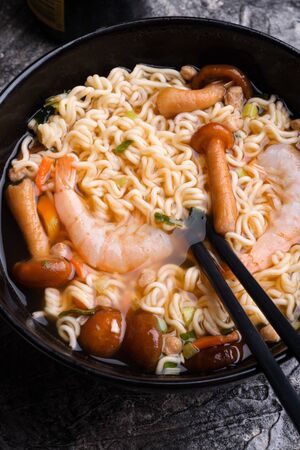 spicy instant noodles soup with shrimps ans mushrooms. close upの写真素材