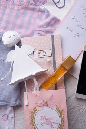 set of expectations and plans of woman at new year with child clothes and angel. concept shot