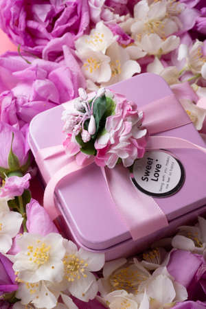 box with gift around roses background. romantic and beauty conceptの写真素材