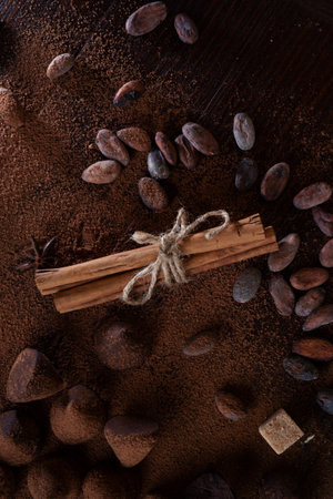 art background with healthy delicious dark truffles, chocolate and ingridients: natural cocoa beans,...