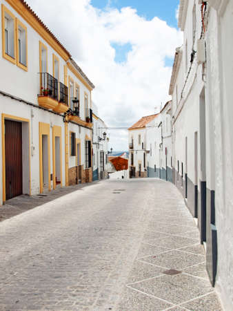 The narrow street with old style white houses in Medina Sidonia, Spainの写真素材