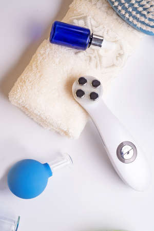 set for massage with hardware equipment, vacuum jars and and massage brush. anti-age and anti-cellulite set for home procedure. beauty conseptの写真素材