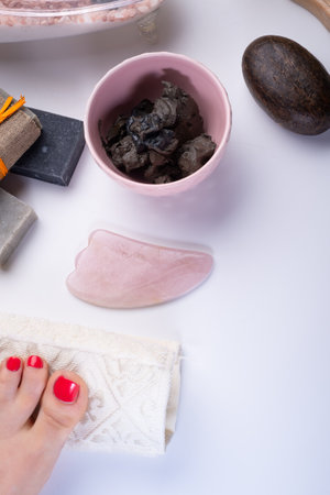 natural spa set with salt, healing mud and soap on white background. flay layの写真素材