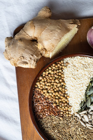 Spices and herbs in ceramic bowl with fresh ginger. Seasoning, Colorful natural additives. Cuisine...