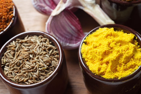 Spices and herbs in ceramic bowls. Food and cuisine ingredients. Colorful natural additives.の写真素材