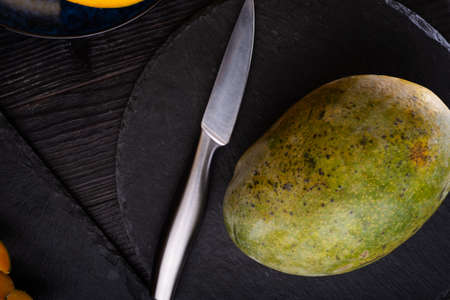 Ripe egyption Mango served at black dish. close upの写真素材