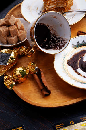 spelling coffee plate  with  coffee grounds and Tarot cards served at dark wooden table. devination conceptの写真素材