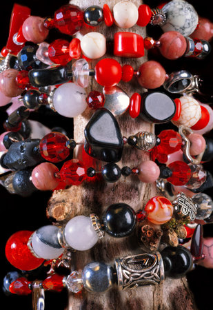 different bracelets with black and red semipreciouse stones with natural lava, shungite, hematite,...