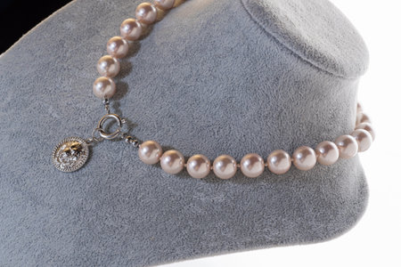 author beautiful pearl necklaces demonstrated on maneken. fashion and jewelry conceptの写真素材