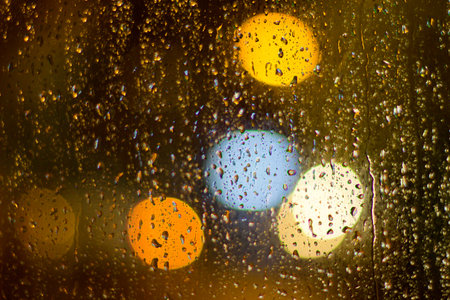 rain drops on windows with bokeh background light