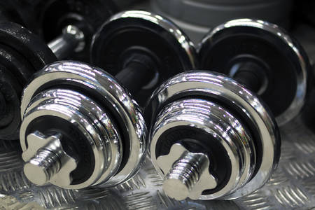 two gray dumbbells for bodybuilding. concept, sports equipment.の写真素材