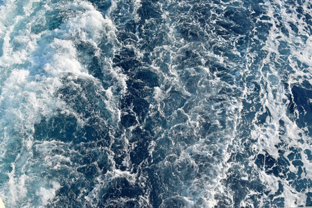 sea water surface foam background, Rapid sea while sailing ship. Dramatic and picturesque scene.
