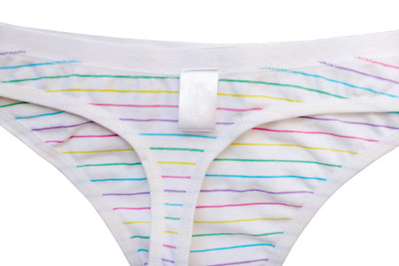 Striped white thong panties isolate. Blank tag on women's shorts.