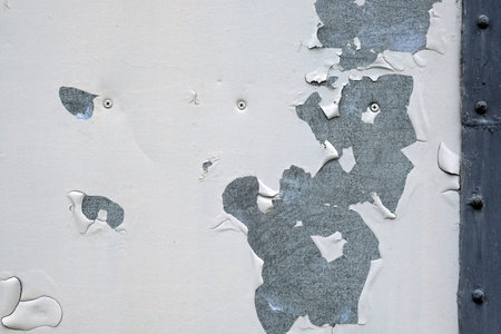 Texture of painted metal plate. Gray sheet of metal. Old shabby white background and rust.