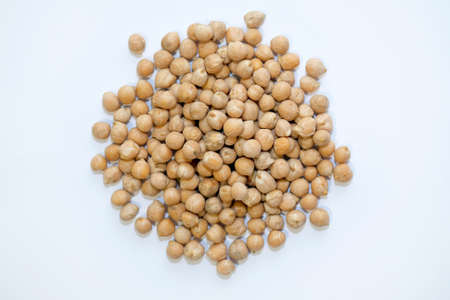 Chickpea lamb or turkish peas top view. Raw legume crop on a white background. Raw chickpea seeds for making hummus and falafel.の写真素材