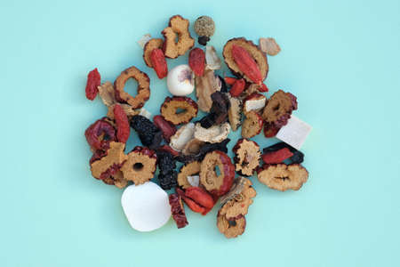Chinese flower - herbal tea vi from above. A mixture of dried goji berries, jasmine, honeysuckle, mulberry leaves, licorice root. Useful and delicious Chinese tea.の写真素材